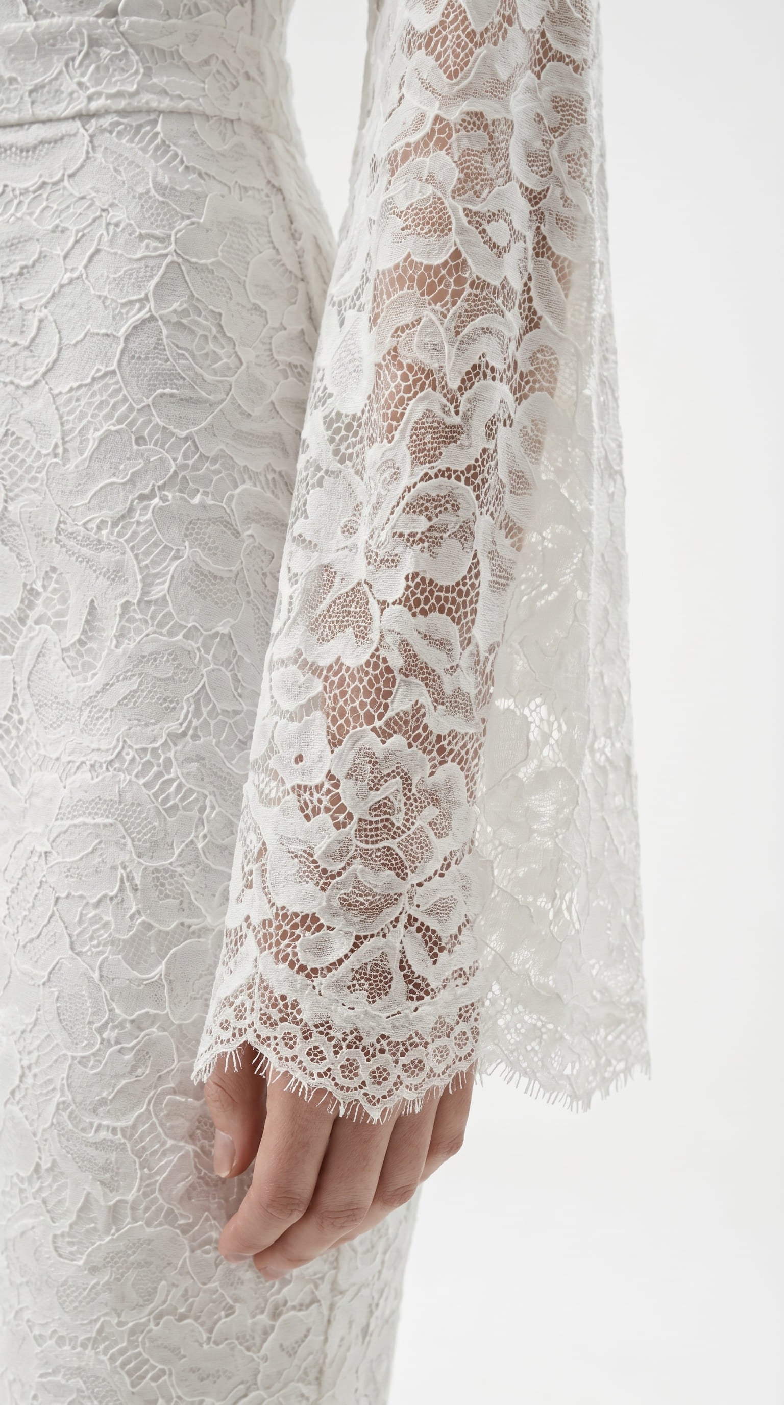 Cinematic movement of the Amalia Empress white suit in motion.