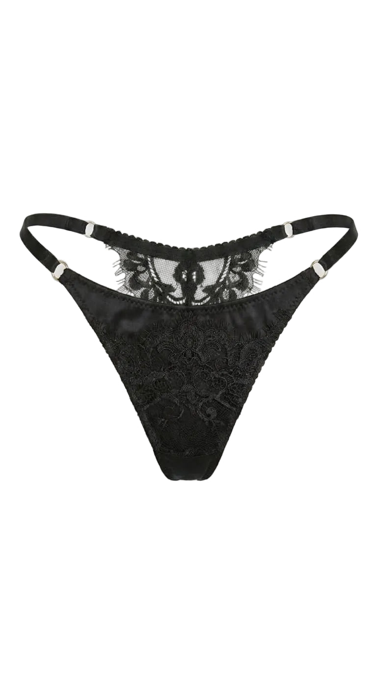 Detailed view of artisanal black embroidery and sheer mesh on the Bella set.