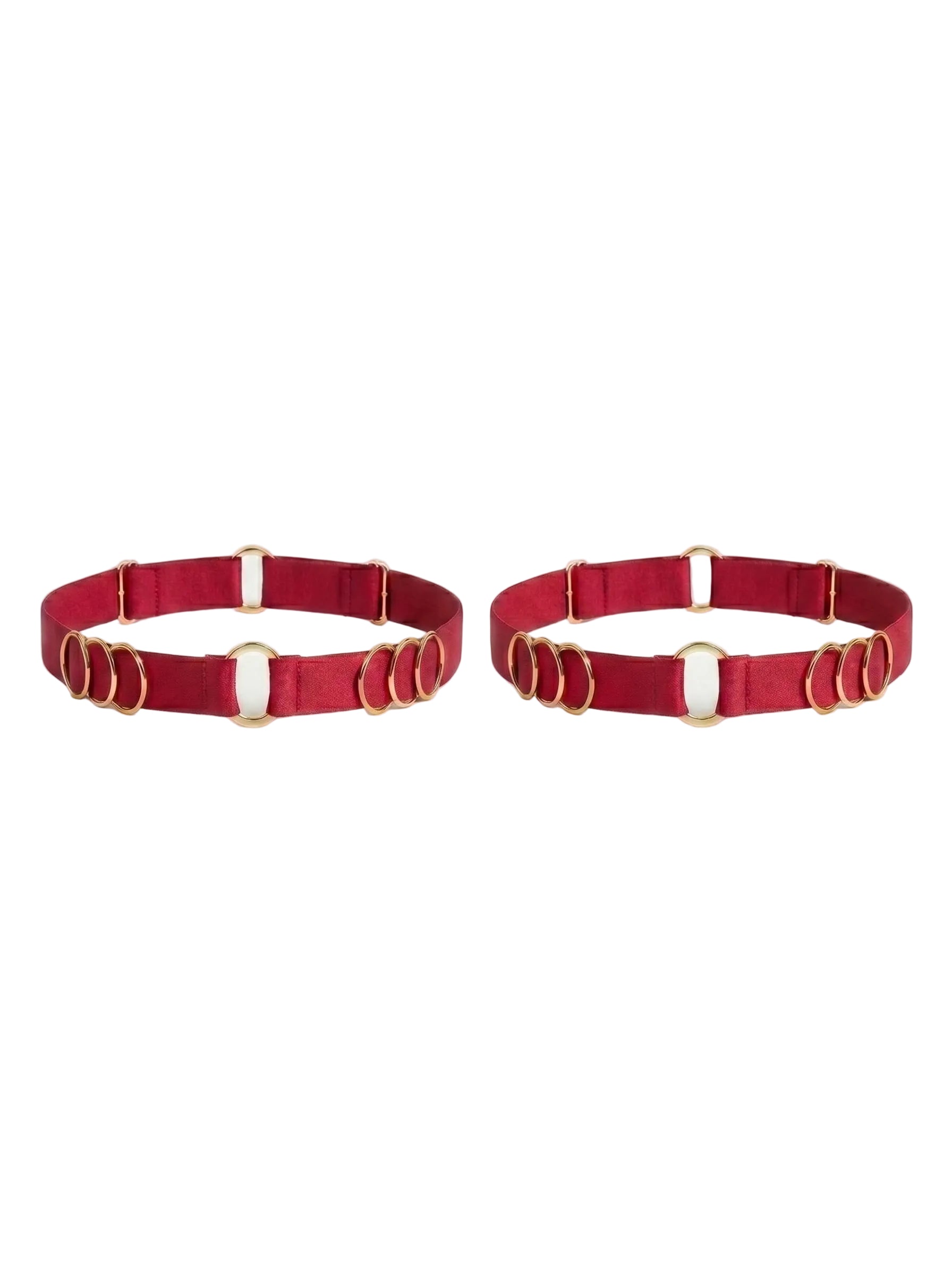 Handcrafted red leg garter featuring signature gold-plated rings.