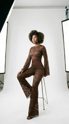 Precision-tailored brown lace jumpsuit designed for a second-skin fit.