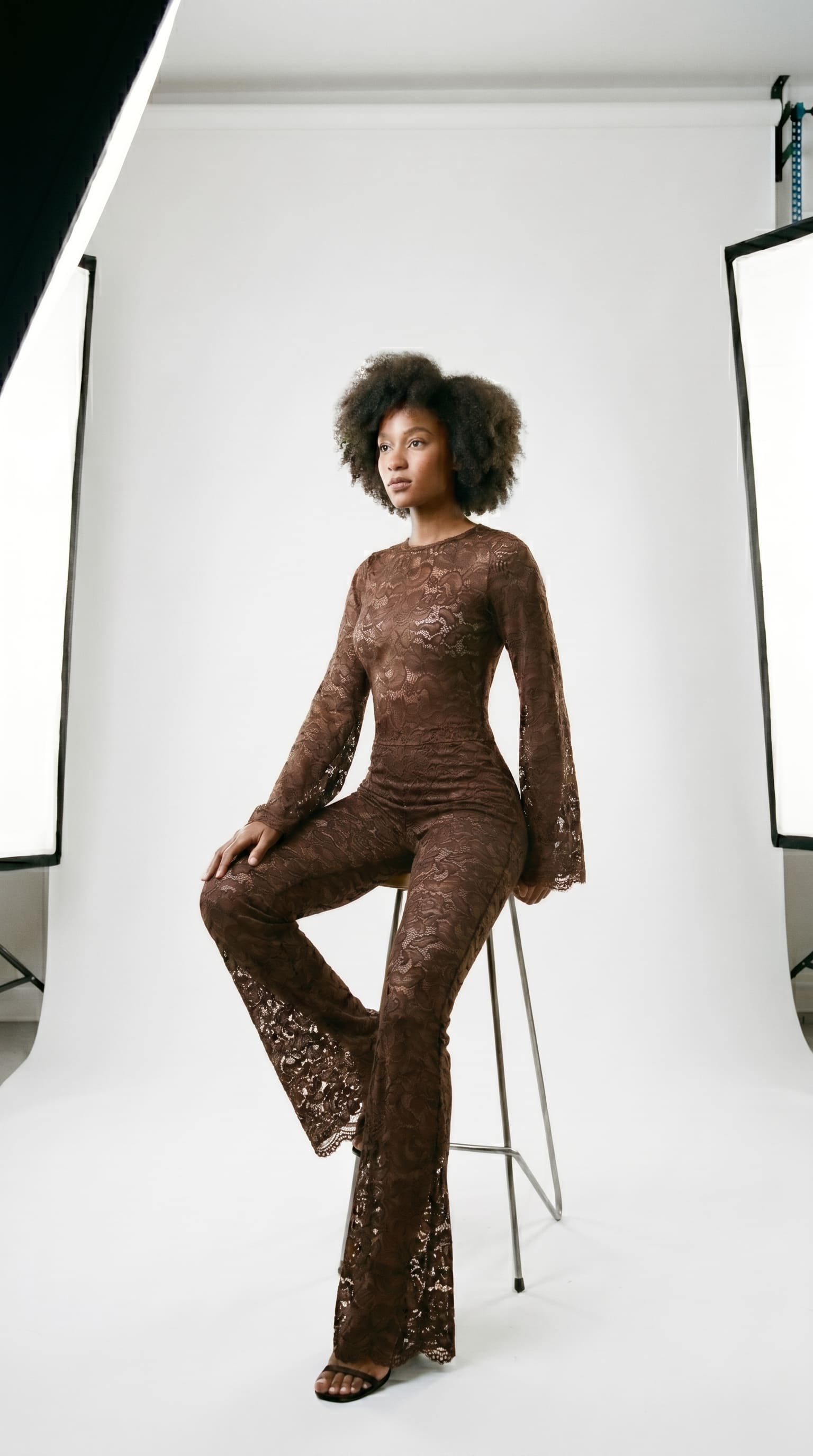 Precision-tailored brown lace jumpsuit designed for a second-skin fit.