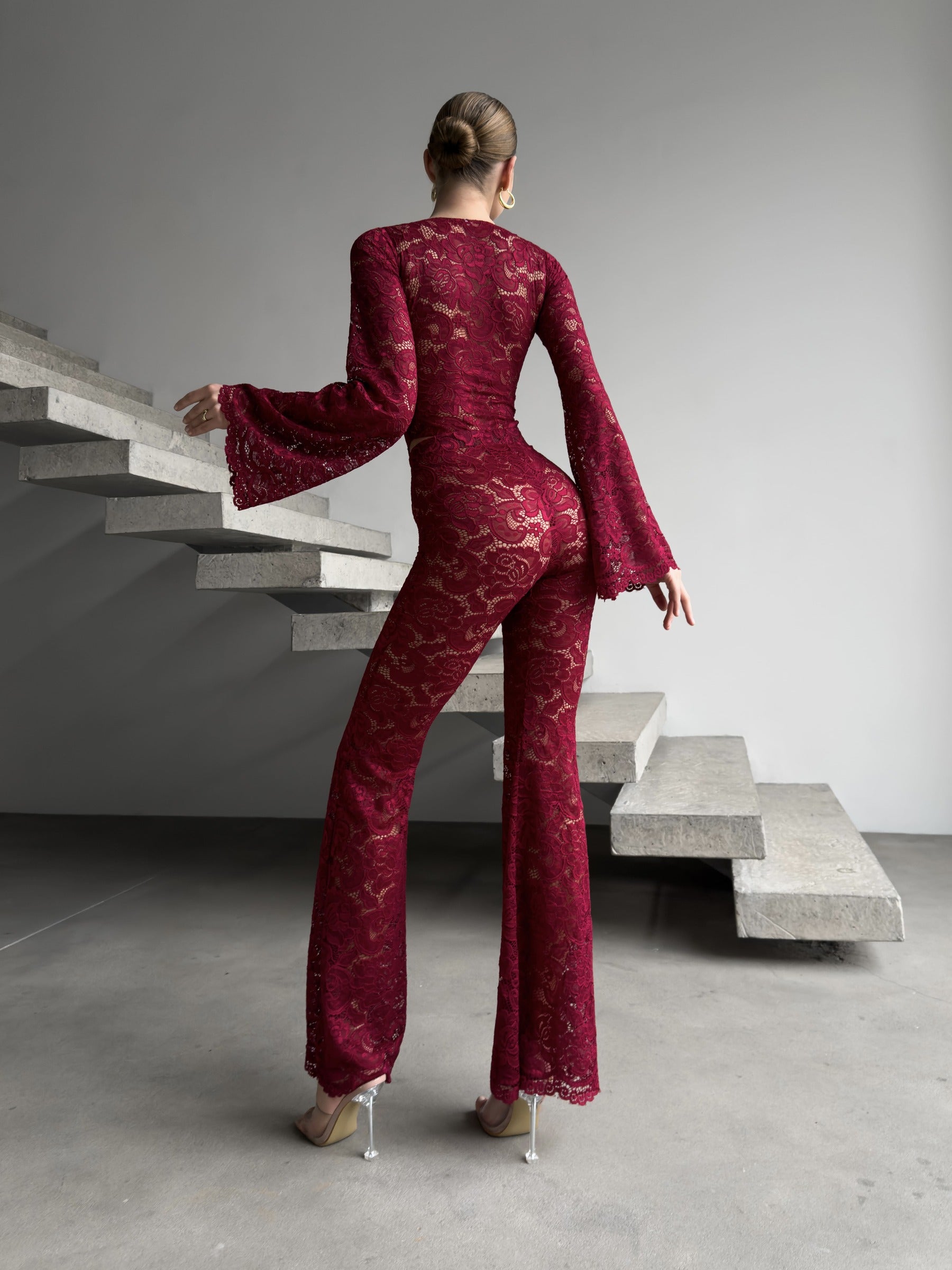 Cinematic movement of the Amalia Empress red suit in motion.