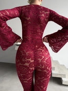 Regal red Amalia Empress lace suit with dramatic flared sleeves.