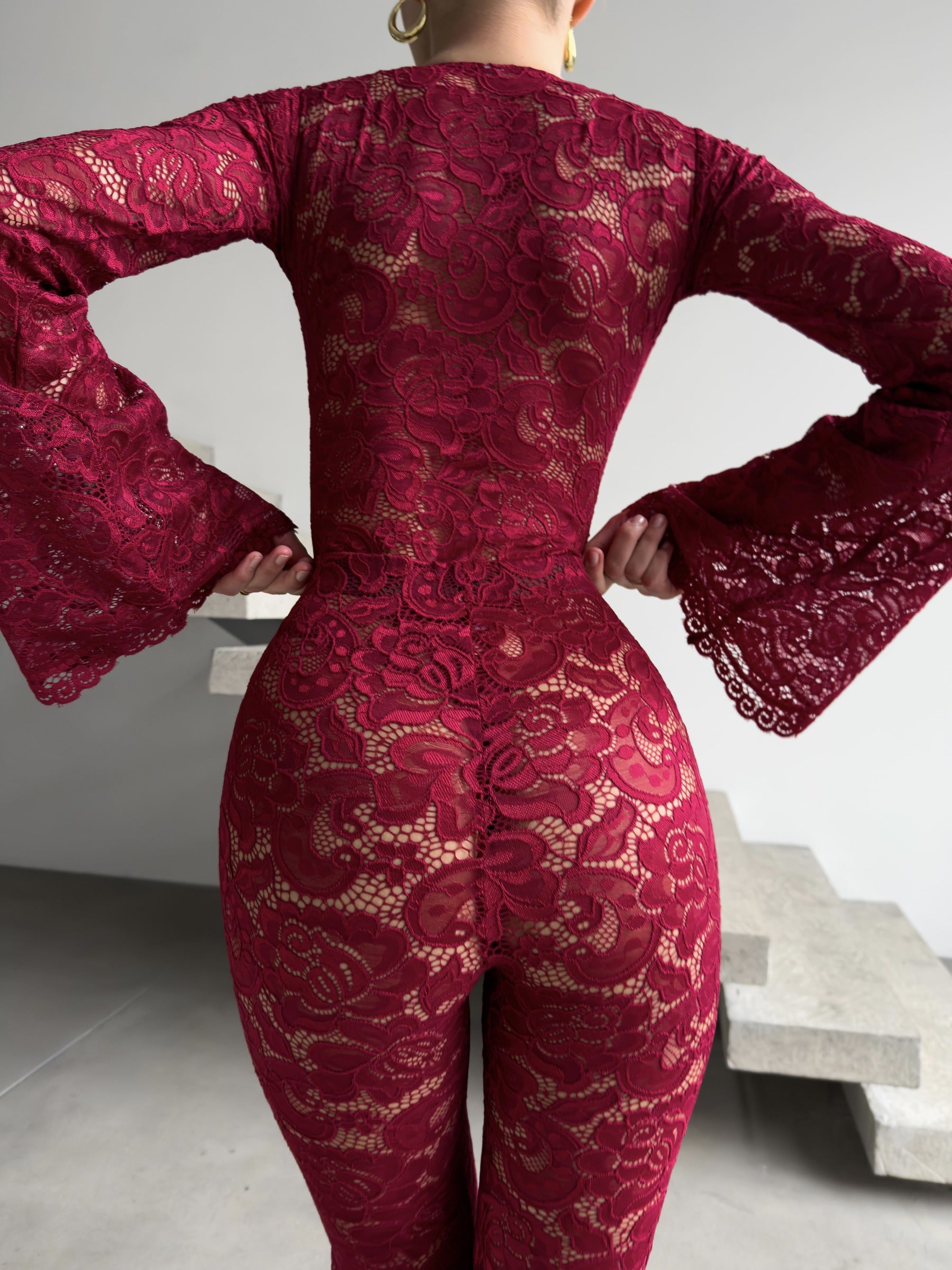 Regal red Amalia Empress lace suit with dramatic flared sleeves.