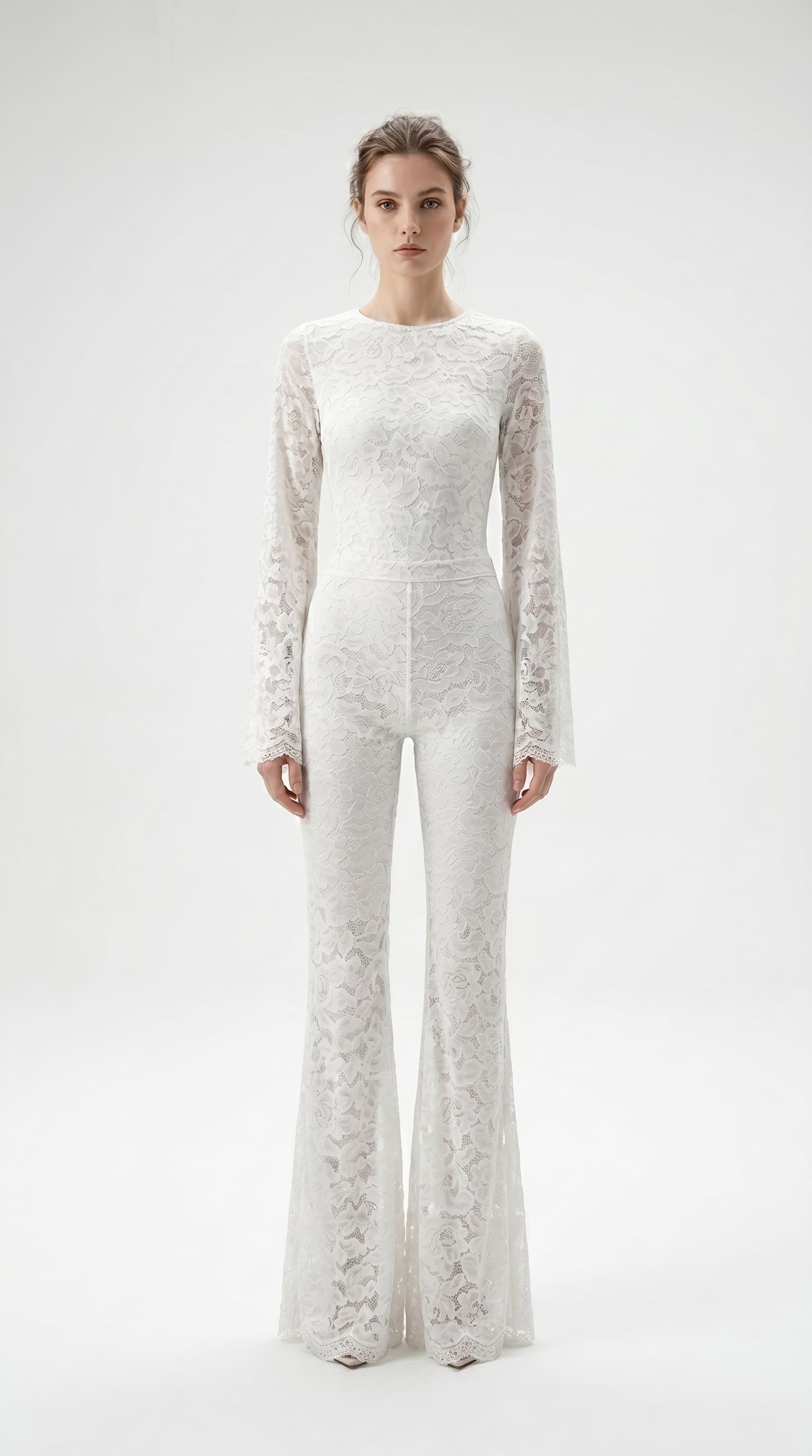 Precision-tailored white lace jumpsuit designed for a second-skin fit.