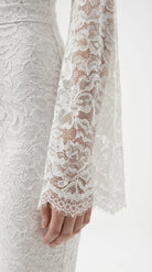 Cinematic movement of the Amalia Empress white suit in motion.