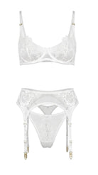 Flat-lay of the complete Amella white lingerie set — floral lace bra, garter belt, and matching panties.
