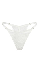 Detailed view of artisanal white embroidery and translucent mesh on the Bella bridal set.