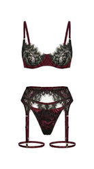 Detailed view of artisanal bordeaux lace and translucent mesh on the Bella set.