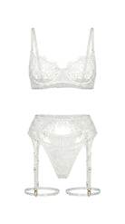 Detailed view of artisanal white embroidery and translucent mesh on the Bella bridal set.