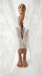 Full view of the handcrafted white lace Femme Totale nightwear set featuring robe, bra, and panties.