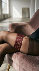 Architectural bordeaux lingerie elastic garter from the Quartet collection.