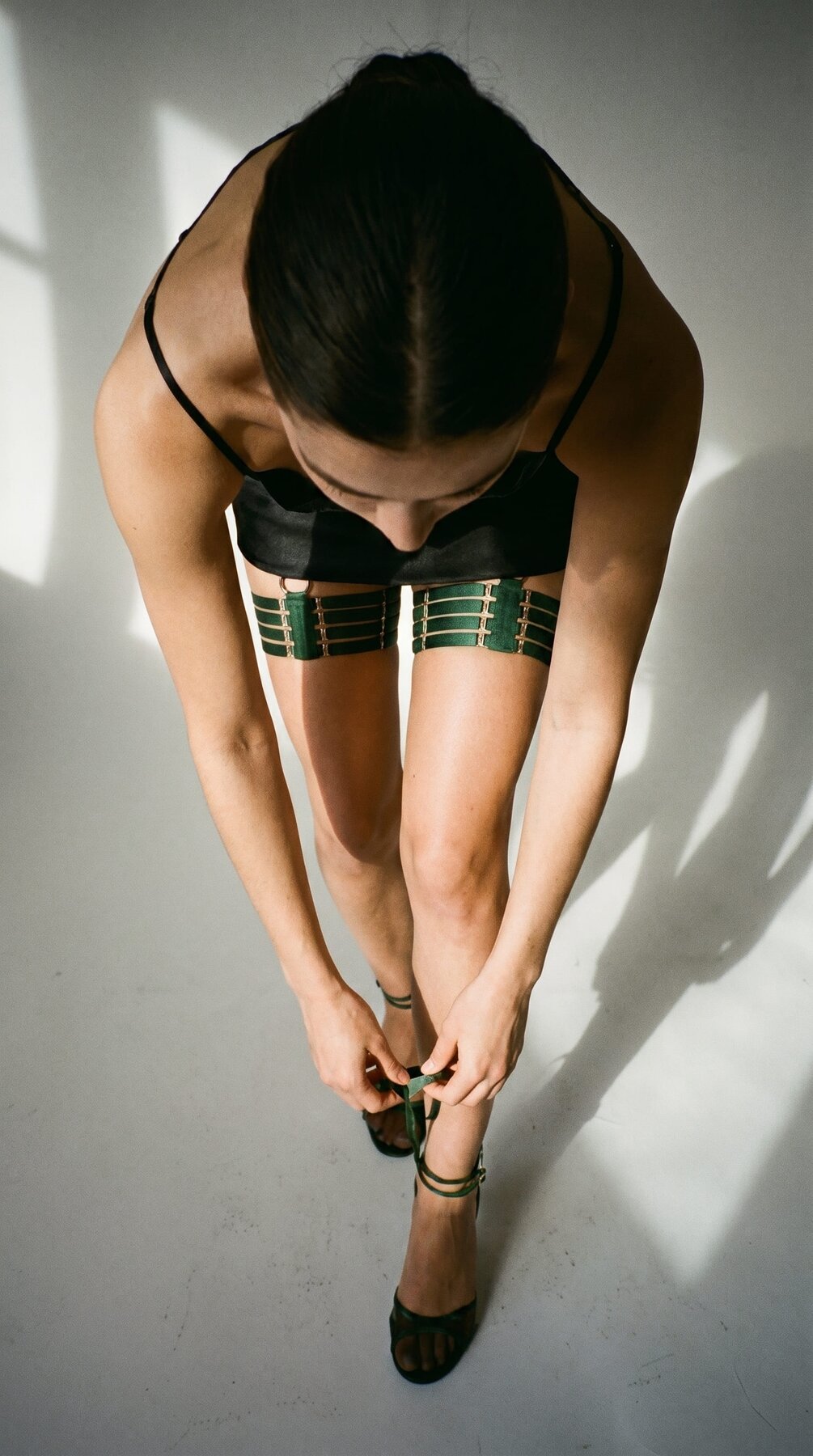 Model wearing the Quartet green garter for a custom, precision fit.