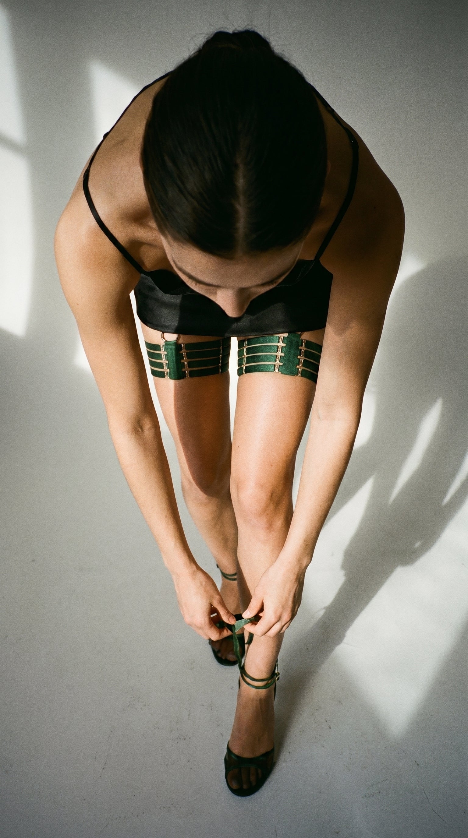 Model wearing the Quartet green garter for a custom, precision fit.