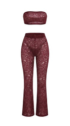 Bespoke red Goddess Aura lace suit with flared pants and bandeau top.