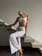 Handcrafted white floral lace jumpsuit from the Goddess Aura collection.
