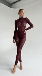 Provocative bordeaux lace jumpsuit from the Iness de Nuit series with a powerful second-skin fit.