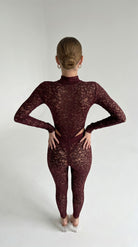Provocative bordeaux lace jumpsuit from the Iness de Nuit series with a powerful second-skin fit.