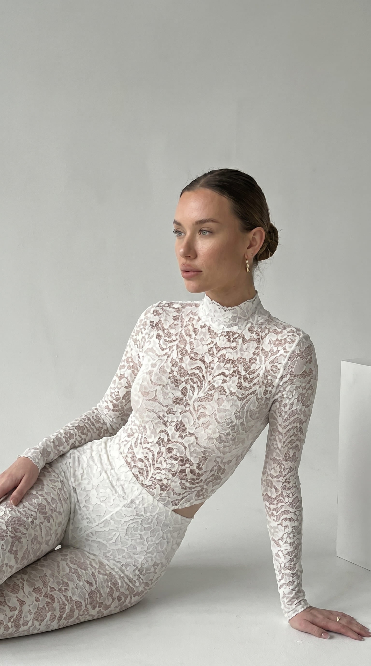 Handcrafted white lace jumpsuit from the Iness de Nuit collection tailored to unique metrics.