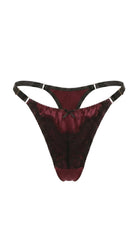 Detailed view of handcrafted deep red lace embroidery on the Jia lingerie set.