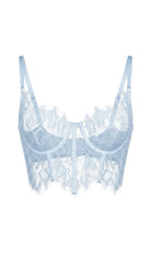 Close-up of the delicate lace stitching and adjustable straps on the blue bodysuit