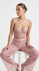 Detailed view of the premium handcrafted pink lace embroidery on pants