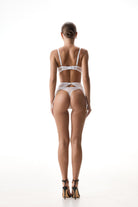 Erin three-piece lingerie set with geometric lace cutouts and gold hardware