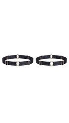 Bespoke black leg garter with gold-plated hardware and adjustable straps.
