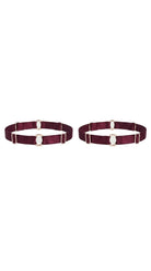 Bespoke bordeaux leg garter with gold-plated hardware and adjustable straps.