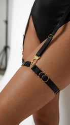 Bespoke black Simple Ring garter with architectural gold hardware.