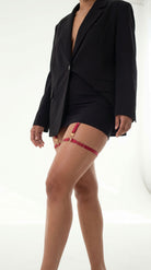 Bespoke red Simple Ring garter with architectural gold hardware.