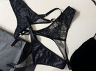 Artisanal black Mono Box set featuring three handcrafted lace panties.
