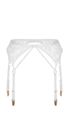 Close-up of handcrafted white lace cup and structural strap engineering on model.
