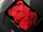 Three red bespoke panties from the Crystall collection featuring artisanal crystal hearts and shimmering details for a perfect architectural fit.