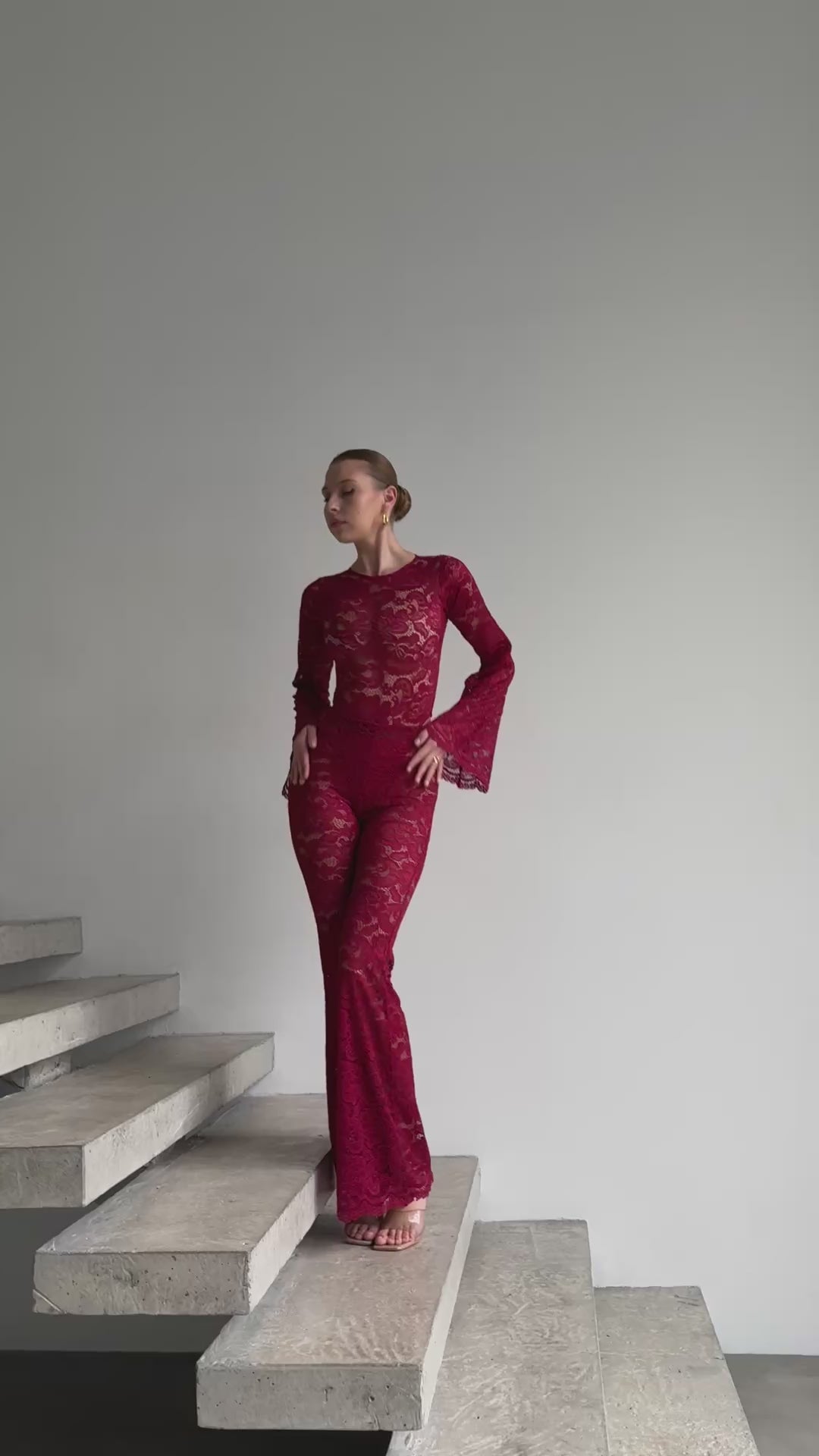 Precision-tailored red lace jumpsuit video from the Amalia Empress collection.