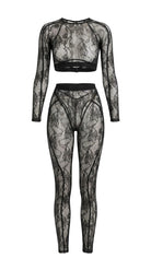 Bespoke black Sensual Edge lace suit with architectural open-back detail.