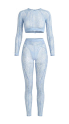 Bespoke blue Sensual Edge lace suit with architectural open-back detail.