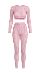 Bespoke pink Sensual Edge lace suit with architectural open-back detail.