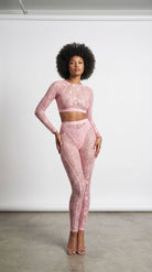 Detailed view of artisanal lace embroidery on the pink Sensual Edge suit.